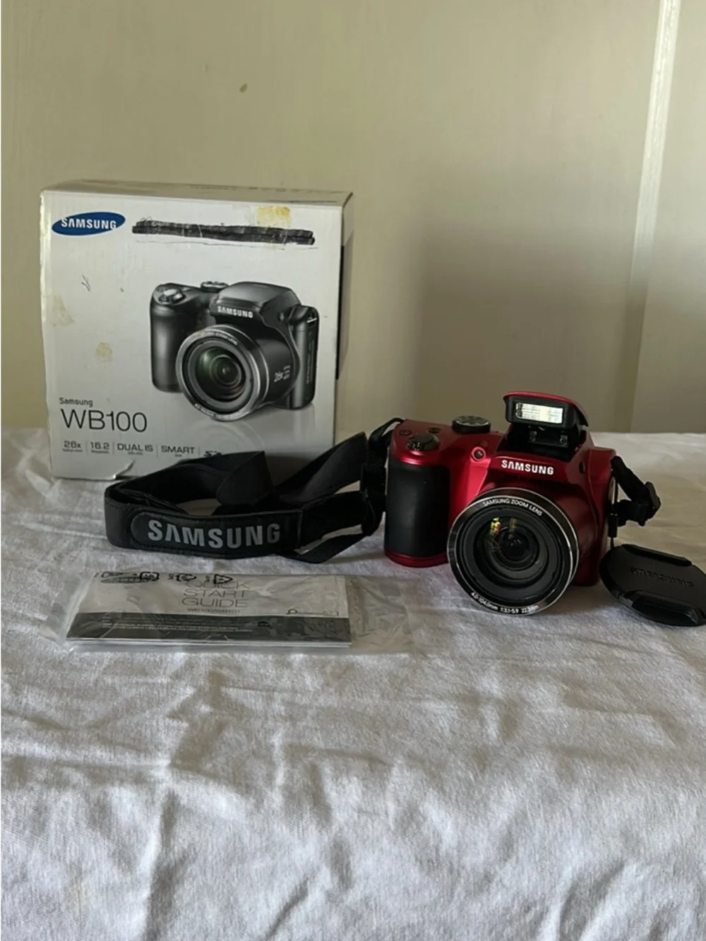 Samsung WB100 Red Digital Camera with Built-in Flash and Strap
